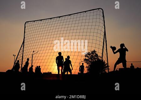 Beach soccer at sunset at Katara Beach Doha Stock Photo