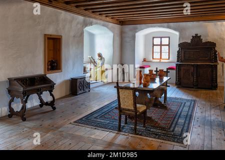 Dining room chamber in medieval interior of Predjama Castle in Slovenia. Stock Photo