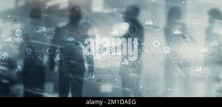 Diagrams and icons on hologram screen. Background with silhouettes Stock Photo