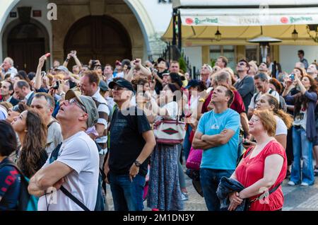 Tourists watch the the procession of the apostles at 'Prazsky orloj', the astronomical clock of Prague's town hall Stock Photo