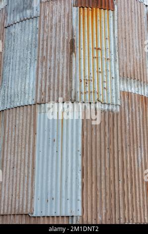 Curved facade of rusted corrugated iron at an old granary Stock Photo