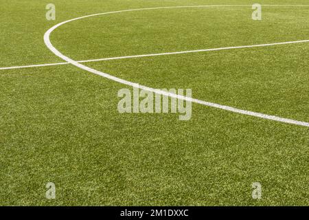 Center circle on a football field made of artificial turf as a background Stock Photo