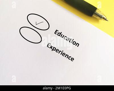 One person is answering question about human resources. He chooses education over experience. Stock Photo