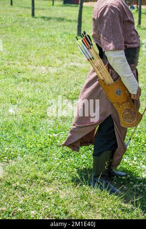 Old style wooden arrows in the case of an archer Stock Photo