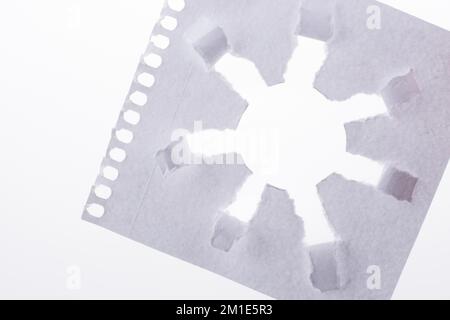 Sun shape made through torn paper in white background Stock Photo - Alamy