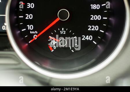 Odometer, rev counter and different vehicle or car controls, as well as climate control controls, lights, multifunction display, seat belt alert or ga Stock Photo