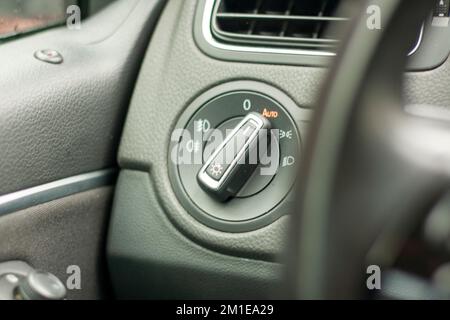 Odometer, rev counter and different vehicle or car controls, as well as climate control controls, lights, multifunction display, seat belt alert or ga Stock Photo