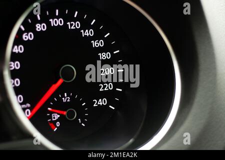 Odometer, rev counter and different vehicle or car controls, as well as climate control controls, lights, multifunction display, seat belt alert or ga Stock Photo