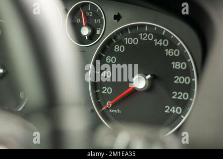 Odometer, rev counter and different vehicle or car controls, as well as climate control controls, lights, multifunction display, seat belt alert or ga Stock Photo