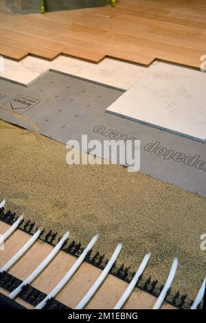 Turin, Piedmont, Italy -11-18-2022- The Fair "Restructura" for the building renovation. Water underfloor heating radiant system Stock Photo
