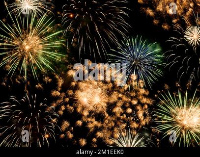 New Year fireworks background, happy holidays and new year concept Stock Photo