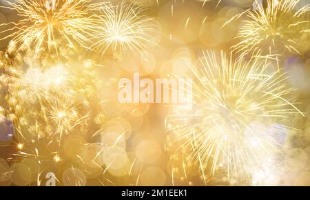 New Year fireworks golden background, happy holidays and new year concept Stock Photo