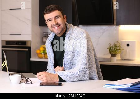 Cozy man working from home office Stock Photo