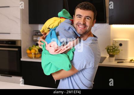 Cute man doing the laundry Stock Photo