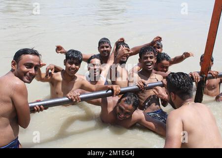 Haridwar, India - Pilgrims are taking holy bath in holy river Ganga at Har-ki-Pauri, Stock Photo