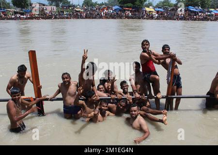 Pilgrims are taking holy bath in holy river Ganga at Har-ki-Pauri - haridwar Stock Photo