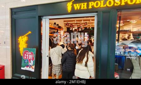 SHANGHAI, CHINA - DECEMBER 12, 2022 - People spend money during the Double 12 Shopping Festival promotion at a department store in Shanghai, China, De Stock Photo