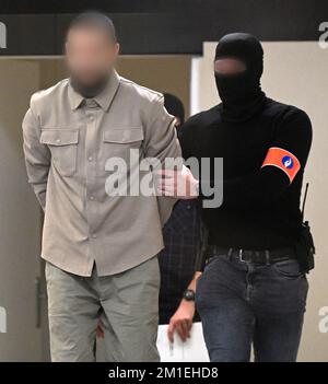 Brussels, Belgium. 12th Dec, 2022. Accused Mohamed Abrini arrives for a session at the trial of the attacks of March 22, 2016, at the Brussels-Capital Assizes Court, Monday 12 December 2022 at the Justitia site in Haren, Brussels. On March 22 2016, 32 people were killed and 324 got injured in suicide bombings at Zaventem national airport and Maalbeek/ Maelbeek metro station, which were claimed by ISIL.  BELGA PHOTO POOL DIDIER LEBRUN Credit: Belga News Agency/Alamy Live News Stock Photo