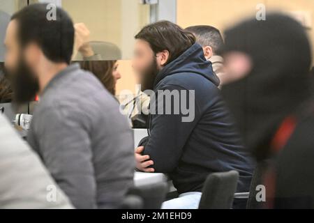 Brussels, Belgium. 12th Dec, 2022. Accused Osama Krayem pictured during a session at the trial of the attacks of March 22, 2016, at the Brussels-Capital Assizes Court, Monday 12 December 2022 at the Justitia site in Haren, Brussels. On March 22 2016, 32 people were killed and 324 got injured in suicide bombings at Zaventem national airport and Maalbeek/ Maelbeek metro station, which were claimed by ISIL.  BELGA PHOTO POOL DIDIER LEBRUN Credit: Belga News Agency/Alamy Live News Stock Photo