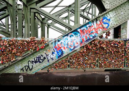 Love padlocks and graffiti on the Hohenzollern bridge, hohenzollernbrucke, Koln Cologne Germany Stock Photo