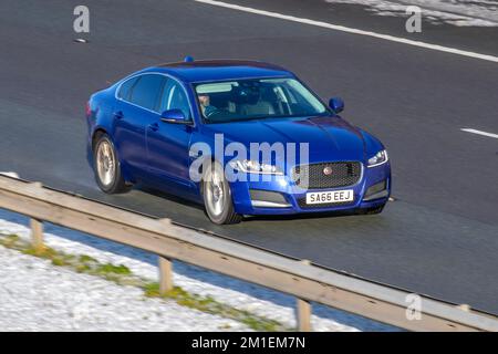 2016 Blue JAGUAR XFD R-SPORT 1999cc 6 speed manual; Cars travelling on a cold winter morning. Wintertime low temperatures with December frost and cold driving conditions on the M61 motorway, UK Stock Photo