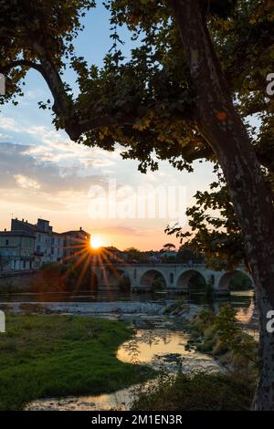 Sunset on the Roman bridge crossing the Vidourle in Sommières Stock Photo