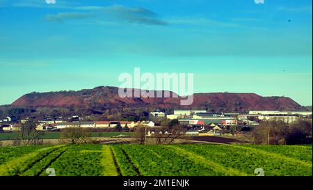 Greendykes shale bings near Broxburn red mountains of West Lothian vast red piles of spent ash waste from post-mining industrial processes Stock Photo