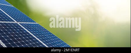 Solar panels on a green background Stock Photo