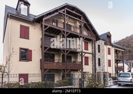 Saint Lary Soulan, France - December 26, 2020: traditional architecture of buildings typical of the town center of the ski resort on a winter day Stock Photo