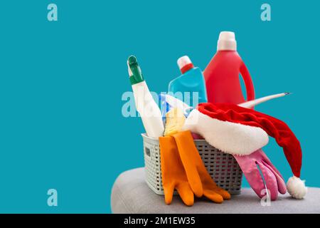 Colorful cleaning set for different surfaces in kitchen, bathroom and other rooms. Empty place for text or logo on blue background. Cleaning service Stock Photo