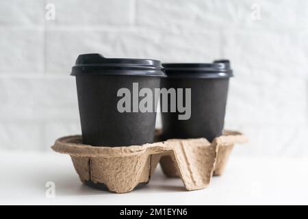 Two take-out coffee in holder. Isolated on a white. Stock Photo