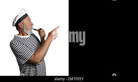 Cheerful sailor in profile on a black and white background. An old sailor with a smoking pipe and a raised index finger. Banner Stock Photo
