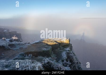 12 December 2022: Rare brocken spectre weather phenemonon delights walkers on Ilkley Moor in a cloud inversion with sunshine above the foggy town below for anyone venturing on the moors this morning. Ilkley, West Yorkshire, England. Credit: Rebecca Cole/Alamy Live News Stock Photo