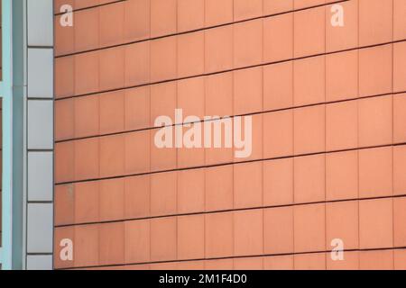 A wall made of beautiful brown square tiles Stock Photo