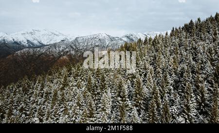 Winter landscape with snow covered mountain peaks. Stock Photo