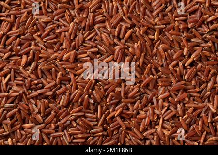 Organic red rice close up full frame as background Stock Photo