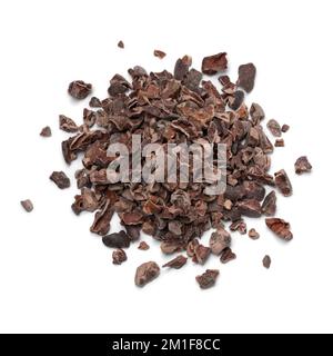 Heap of Cacao nibs, dried and crushed cacao beans close up isolated on white background Stock Photo