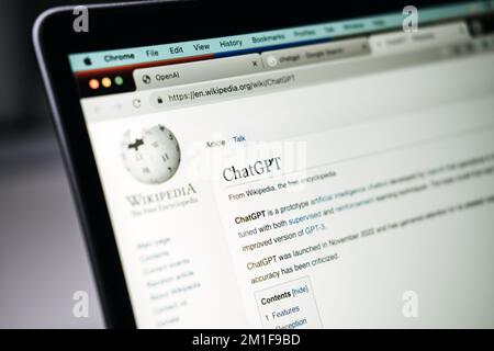 Screen with ChatGPT chat with AI or artificial intelligence. Man search for information using artificial intelligence chatbot developed by OpenAI Stock Photo
