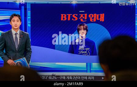 Jin, a member of K-pop group BTS, is joining the South Korean Army on TV at Yongsan Railway Station in Seoul. Jin, the member of the K-pop group BTS to serve in the military, has released a photo of himself with a military haircut ahead of his enlistment. The 30-year-old vocalist will enter a boot camp of a front-line Army 5 division in Yeoncheon, 60 kilometers north of Seoul, on 13 December, according to military and industry sources. After undergoing a five-week basic training program, Jin will be assigned to a local unit, they said. All South Korea able-bodied men are obliged to serve betwe Stock Photo