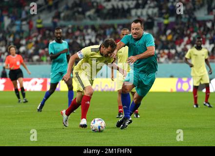 Team B's Alessandro Del Piero (left) and Team A's John Terry battle for the ball during a Workers and FIFA Legends Match at the Al Thumama Stadium, Doha, Qatar. Picture date: Monday December 12, 2022. Stock Photo