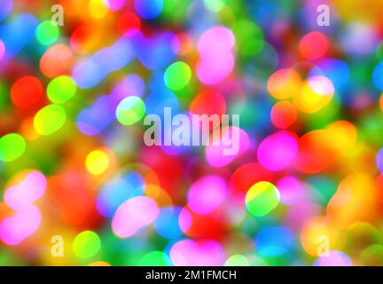 Neon bokeh background with blue, yellow and pink colors. Blur halftone glitter texture. Blurred night lights glow. Stock Photo
