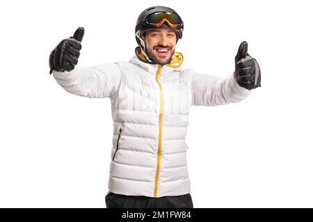 Happy male skier gesturing both thumbs up in front of camera isolated on white background Stock Photo