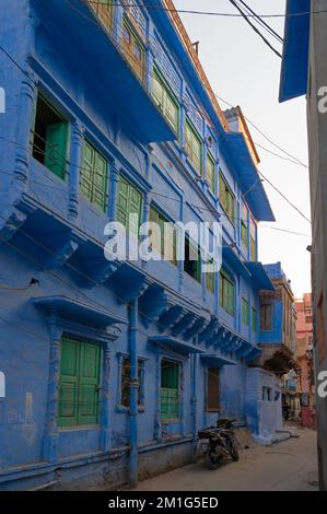 Jodhpur, Rajasthan, India - October 21st, 2019 : Traditional Blue coloured house with green colour windows. Blue is symbolic for Hindu Brahmis, being Stock Photo