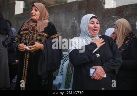 Jenin, Palestine. 12th Dec, 2022. The mother of the 15-year-old Palestinian girl, Jana Zakarneh, mourns during her funeral in the city of Jenin, in the occupied West Bank. Jana was shot dead by the Israeli army while she was on the roof of her house, during an army raid on the city. Credit: SOPA Images Limited/Alamy Live News Stock Photo
