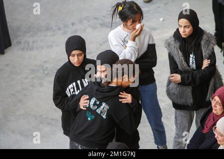 Jenin, Palestine. 12th Dec, 2022. Friends and relatives of the 15-year-old Palestinian girl, Jana Zakarneh, mourn during her funeral in the city of Jenin, in the occupied West Bank. Jana was shot dead by the Israeli army while she was on the roof of her house, during an army raid on the city. (Photo by Nasser Ishtayeh/SOPA Images/Sipa USA) Credit: Sipa USA/Alamy Live News Stock Photo