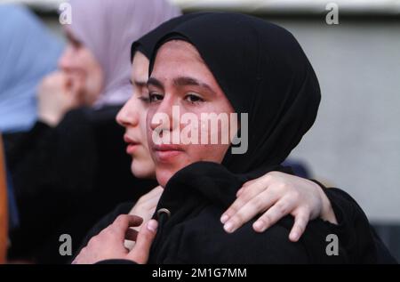 Jenin, Palestine. 12th Dec, 2022. Friends and relatives of the 15-year-old Palestinian girl, Jana Zakarneh, mourn during her funeral in the city of Jenin, in the occupied West Bank. Jana was shot dead by the Israeli army while she was on the roof of her house, during an army raid on the city. (Photo by Nasser Ishtayeh/SOPA Images/Sipa USA) Credit: Sipa USA/Alamy Live News Stock Photo