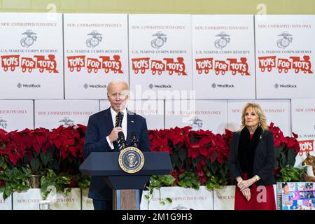 Arlington, United States. 12th Dec, 2022. U.S. President Joe Biden speaks while joined by First Lady Jill Biden while participating in a United States Marine Corps Reserve Toys for Tots event at Joint Base Myer-Henderson Hall in Arlington, Virginia, on Monday, December 12, 2022. The Biden's are joining spouses of senior Department of Defense and Service Leadership and local military children in sorting donated toys for distribution to families in need ahead of the holidays. Photo by Al Drago/UPI Credit: UPI/Alamy Live News Stock Photo