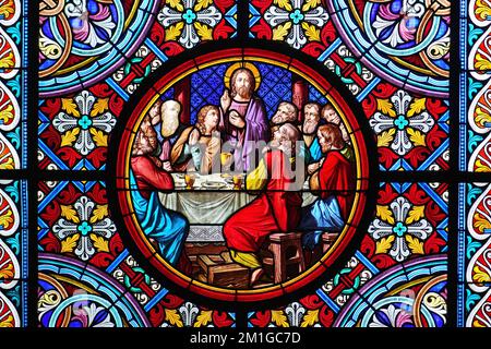 Basel Cathedral Minster. Stained glass window. The Last Supper is the final meal that Jesus shared with his Apostles. Basel, Switzerland - December 20 Stock Photo