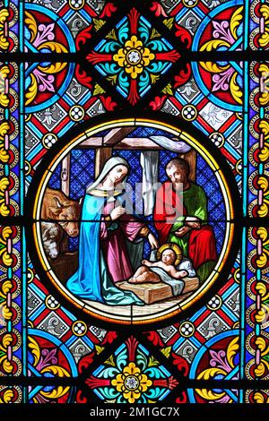 Nativity Scene. Stained glass window in the Cathedral. Basel, Switzerland - December 2022 Stock Photo