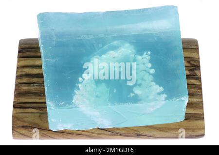 Dead Sea salt soap on olive wood underlay  isolated on white background Stock Photo